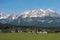 View of the Altay Alpes, village and grazing cows.