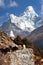 View of Ama Dablam with stupa and caravan of yaks