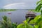 View of the Amazon River tributary in Iquitos, Peru. A rainbow over the river and a beautiful building floating on the water