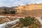 View of Amber fort and palace from Kesar Kyari Bagh garden on Maotha Lake. Rajasthan. India