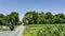 View of An Amish Horse and Carriage Traveling Down a Rural Country Road