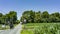 View of An Amish Horse and Carriage Traveling Down a Rural Country Road