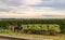 View of an Amish Man Putting Harvested Tobacco on a Wagon to Bring To Barn for Drying