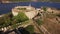 View of the ancient fortress Mamula, a yacht near it and the coast of the bay