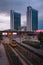 View of ancient Milanese tram in modern district at sunset