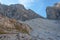 View of ancient moraines at the foots of rocky ridges of Cima Undici Mountain