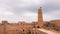 View of ancient Ribat of Monastir fortress with tower and flag of Tunisia