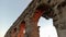 View of ancient roman acqueduct at sunset