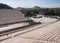 View of the ancient stadium of the first Olympic Games in white marble - Panathenaic Stadium - overlooking the Acropolis and the