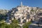 View of the ancient town and historical center called Sassi, perched on rocks on top of hill, Matera, Basilicata, Italy