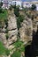 View on ancient village Ronda located precariously close to the edge of a cliff in Andalusia, Spain