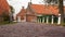 View from approach route over on traditional village with farmhouses and old pavements.