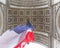 View of Arc de Triomp with flag of France waving in wind on Place de Gaulle in Paris, France