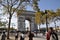 View of the Arc de Triomphe in Paris. People on the street.