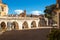 View of the arch of the aqueduct on the Piazza Garibaldi of Sulmona and people strolling