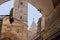 View through the arch of the Arabian market to the bell tower of the Church of the Redeemer and the minaret of the Omar Mosque in