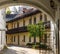 View through the arch at the cozy medieval inner yard in the old town of Vilnius, Lithuania