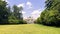 View of the Arch of Peace from Parco Sempione on the meadow