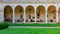 View of arched corridor and inner courtyard of Boston Public Library, where locals rest or gather