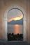 View through arched door; mediterranean sunset