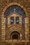 View from the arched stone window of the medieval spanish church in romanesque  style and cup of wine, vector