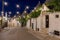 View of architectures with cone roofs made of small stones in the evening in  Alberobello, Italy