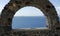 View through archway to aegean sea of santorini island
