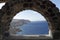 View through archway to aegean sea of santorini island