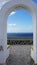 View through archway to aegean sea of santorini island