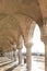 View through the archway underneath the Doge`s Palace in San Marco Square