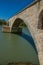 View of the arcs of the Pont d`Avignon bridge under a sunny blue sky, city of Avignon.