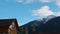 View of Arkhyz mountain peaks and white clouds floating in bright blue sky over mount. Caucasian nature.