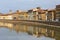 View on Arno river and colorful building, Pisa, Italy