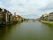 View of the Arno river and the medieval Santa Trinita bridge in Florence, Italy