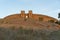 View of Arraiolos castle on top of the hill in Alentejo, Portugal at sunset