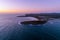 View of Arrawarra headland ocean coastline at sunrise.