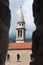 View through arrowslit on bell tower of Saint Ivan church in Budva