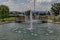 View of artificial pond and fountain close up with beauty drops, town Delchevo among Maleshevo and Osogovo mountains