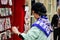 A view of Asian lady coosing a card in York in September 2018