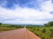 View of a asphalt road with mountains Pungo Andongo, Pedras Negras black stones