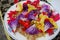 View of an assortment of edible flowers with plate