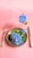 View of an assortment of edible flowers with plate and fork