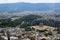 View of Athens city from Acropolis showing ancient ruin, buildings architecture,urban streets, green trees and mountain background