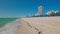 View of Atlantic Ocean waves rolling onto sandy shores of Miami Beach.