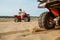 View on atv wheel, man in helmet on background