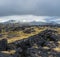 View during auto trip in West Iceland, Snaefellsnes peninsula, View Point near Svortuloft Lighthouse. Spectacular black volcanic