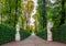 View of autumn trees and ancient marble statues in Summer Garden