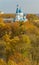 View of the autumn trees and the Intercession Cathedral in Gatchina from the observation tower of the Grand Palace