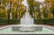 View of autumn trees and marble fountain in Summer Garden