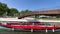 View on Aveiro Moliceiro touristic tour boat crossing the urban water canal of Ria de Aveiro with tourists, Portugal